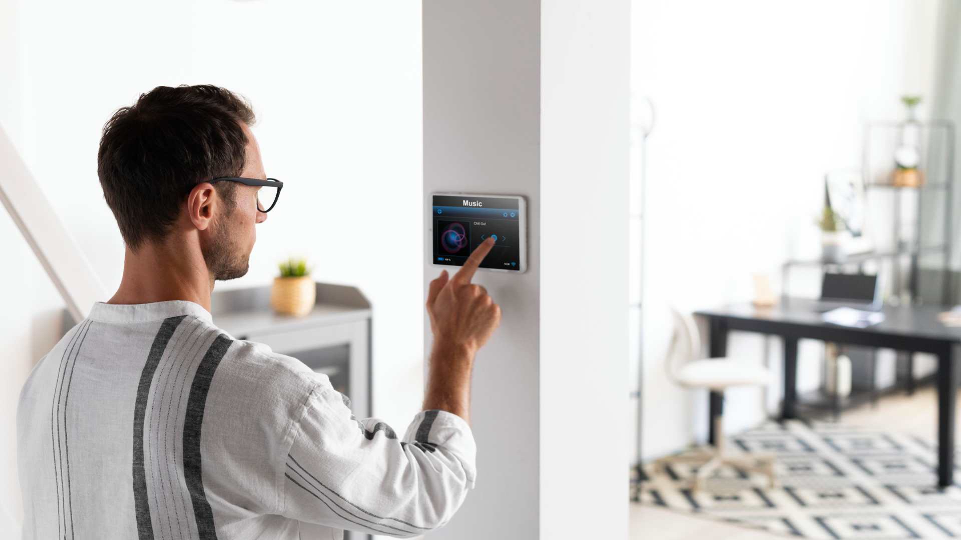 man-using-tablet-his-smart-home
